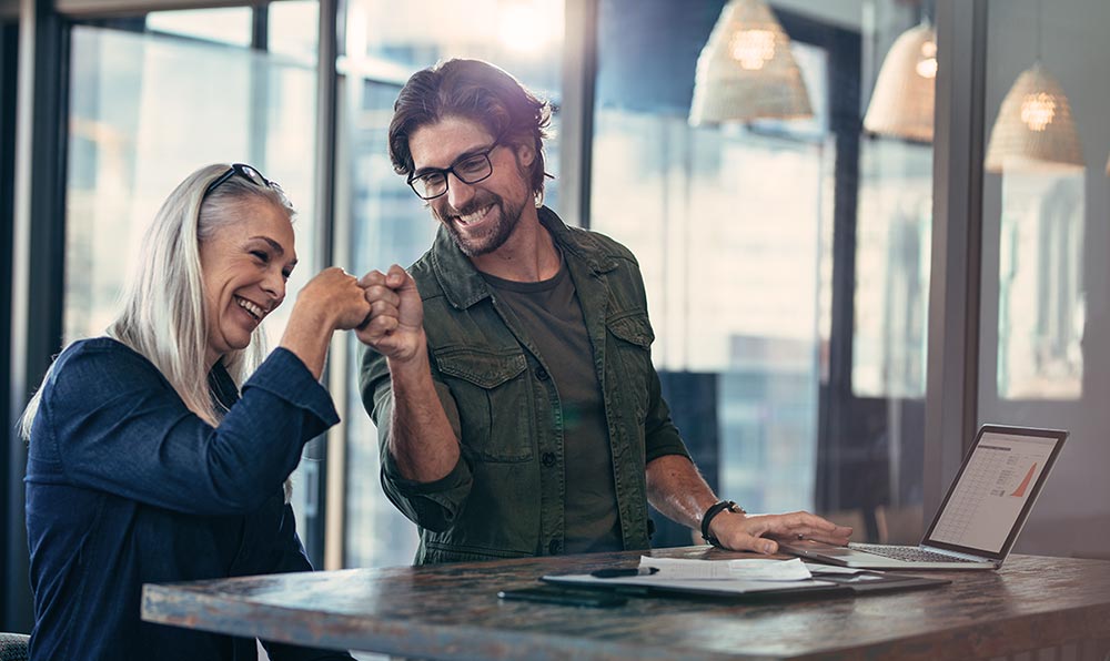 Two people fist bumping